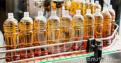 Filling bottles with juice Stock Photo