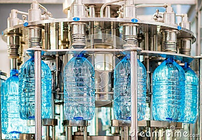 Filling bottles with water Stock Photo