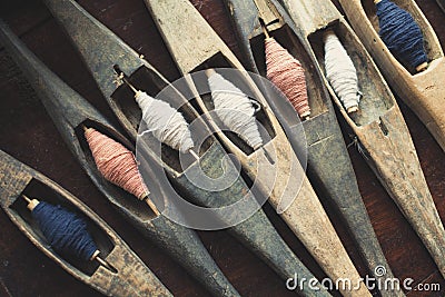 Filling carriers of the loom with spool of threads inside Stock Photo