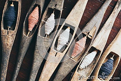 Filling carriers of the loom with spool of threads inside Stock Photo