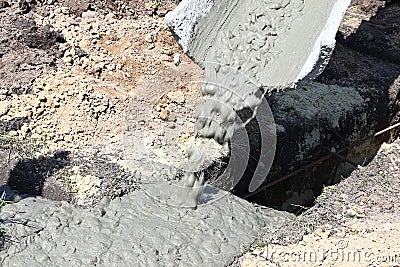 Filling of concrete from special equipment sleeve from mix of ce Stock Photo