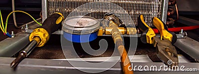 Filling an industrial refrigeration unit with freon Stock Photo