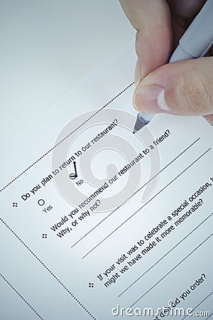 Filling in negative customer satisfaction survey Stock Photo