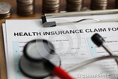 Filling out document health insurance claim form Stock Photo