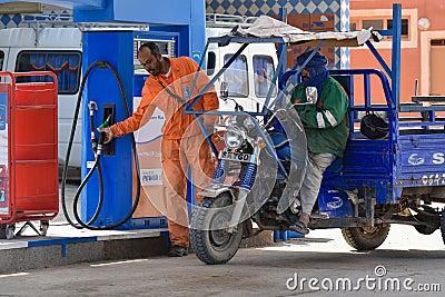 Filling station worker, Morocco Editorial Stock Photo