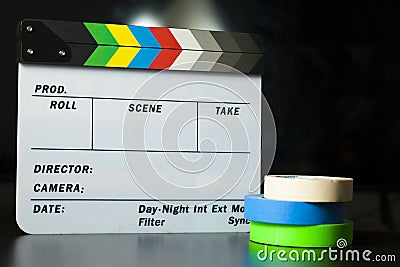 Film clapper board with colored marking tapes in internet content producer dark background studio Stock Photo