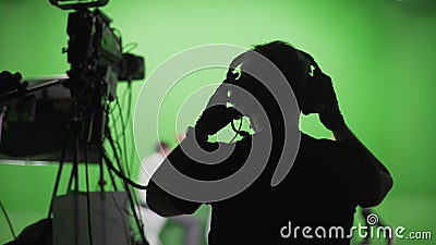 Film Crew in Green Studio Stock Photo