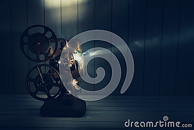 Film projector with dramatic lighting Stock Photo