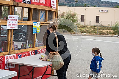 Filmore, California, United States - June 28, 2020: Customers with masks line up to buy fireworks from stands in Filmore ahead of Editorial Stock Photo