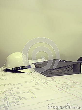 Filter effect color of Industrial blueprint with safety helmet Stock Photo