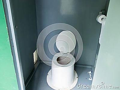 Filthy camp ground outhouse latrine inside toilet Stock Photo