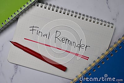 Final Reminder write on a book isolated wooden table Stock Photo