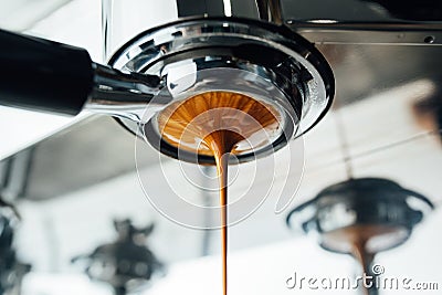 Final stage of the espresso extraction process from bottomless portafilter Stock Photo