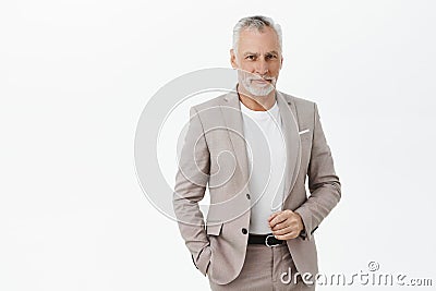 Finance, business and success concept. Portrait of rich senior male entrepreneur in elegant suit with grey hair and Stock Photo