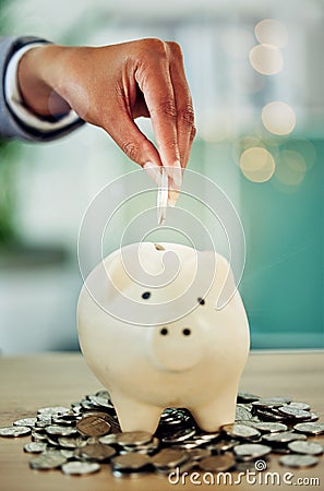 Finance growth, saving money and coins in a piggy bank for the best investment strategy a banking service, contact us Stock Photo