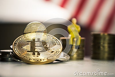 Finance investment risk Business Internet concept: Bitcoin digital currency on blur stack coins and Miniature business sitting on Stock Photo