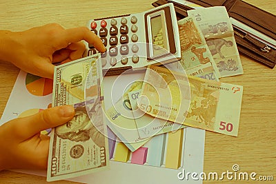 Finances, currency, business and people concept - close up of male and female hands giving or exchanging money Stock Photo