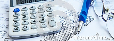 Financial accounting with paper reports and calculator Stock Photo