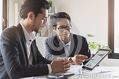 Financial advisory services. Asian advisor showing plan of investment to clients in the consultancy office Stock Photo