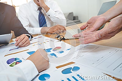 Financial advisory services. Asian advisor showing plan of investment to clients in the consultancy office Stock Photo