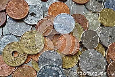 Financial background consisting of coins from many different countries in the metal box Stock Photo