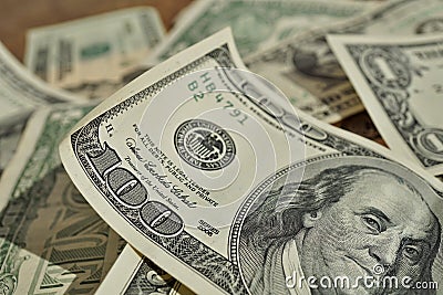 Financial background made of random heap of bank notes in the value of one, twenty and one hundred USD in the accidental pi Stock Photo