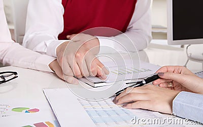 Financial business meeting: young married couple - adviser and c Stock Photo