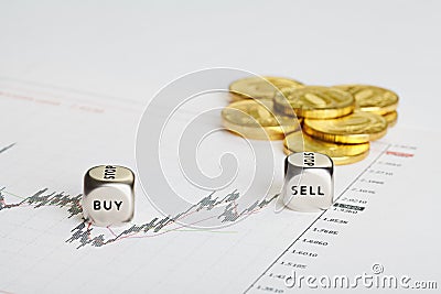 Financial chart, coins and dices cubes with words SELL BUY. Stock Photo