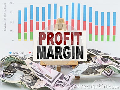 Among financial charts and money is a sign with the text - PROFIT MARGIN Stock Photo