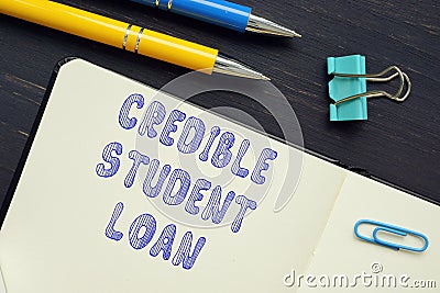 Financial concept about CREDIBLE STUDENT LOAN with phrase on the piece of paper Stock Photo