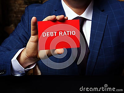 Financial concept about DEBT RATIO with phrase on the piece of paper. Business photo shows the ratio of total debt to total Stock Photo