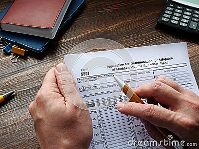 Financial concept about Form 5307 Application for Determination for Adopters of Modified Volume Submitter Plans with sign on the Editorial Stock Photo