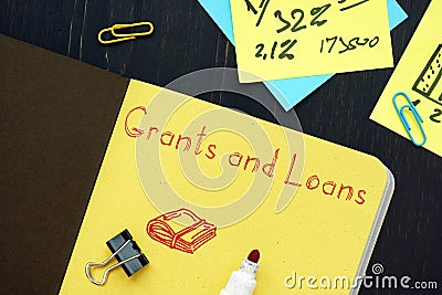 Financial concept about Grants And Loans with phrase on the page Stock Photo