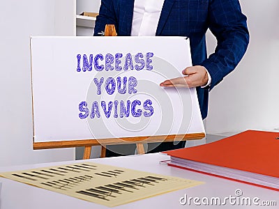 Financial concept about INCREASE YOUR SAVINGS with sign on the sheet Stock Photo