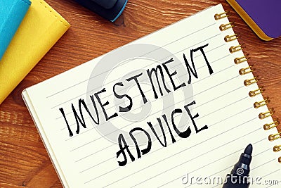 Financial concept about INVESTMENT ADVICE question marks with sign on the sheet Stock Photo