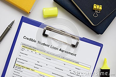 Financial concept meaning Credible Student Loan Agreement with sign on the financial document Stock Photo