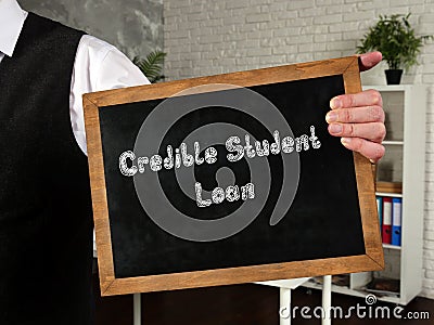 Financial concept meaning Credible Student Loan with inscription on the piece of paper Stock Photo