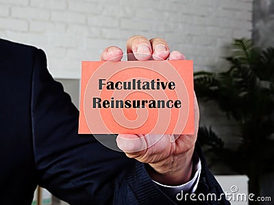 Financial concept meaning Facultative Reinsurance with sign on the sheet Stock Photo