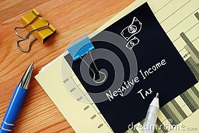 Financial concept meaning Negative Income Tax with phrase on the sheet Stock Photo