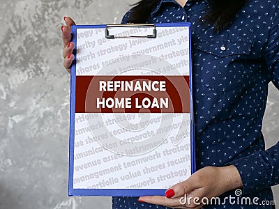 Financial concept meaning REFINANCE HOME LOAN with sign on the piece of paper Stock Photo