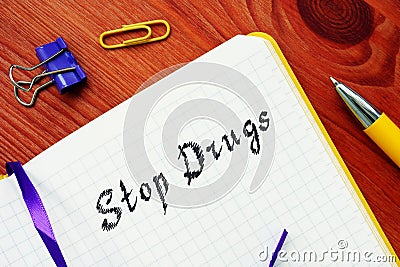 Financial concept meaning Stop Drugs with sign on the page Stock Photo