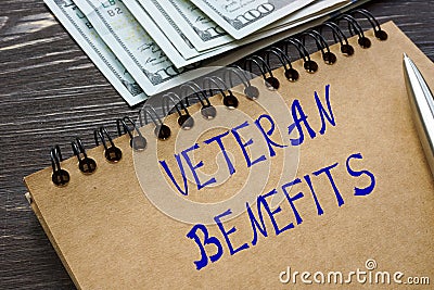 Financial concept meaning VETERAN BENEFITS with inscription on the page Stock Photo