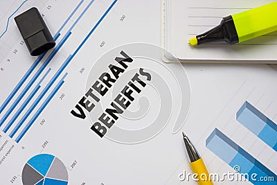 Financial concept meaning VETERAN BENEFITS with phrase on the piece of paper Stock Photo