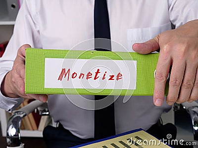 Financial concept about Monetize with phrase on the sheet Stock Photo