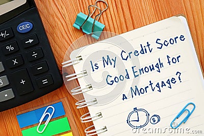 Financial concept about Is My Credit Score Good Enough for a Mortgage? with sign on the sheet Stock Photo