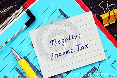 Financial concept about Negative Income Tax with sign on the piece of paper Stock Photo