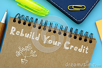 Financial concept about Rebuild Your Credit with sign on the piece of paper Stock Photo