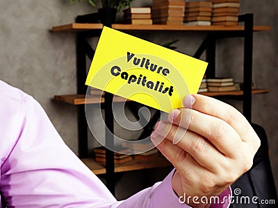 Financial concept about Vulture Capitalist with phrase on the yelow business card Stock Photo