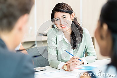 Financial consultant in office discussing numbers Stock Photo