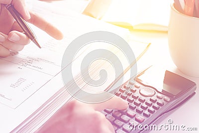 Financial data analyzing. Close-up photo of a businessman's hand counting on calculator in office or home Stock Photo